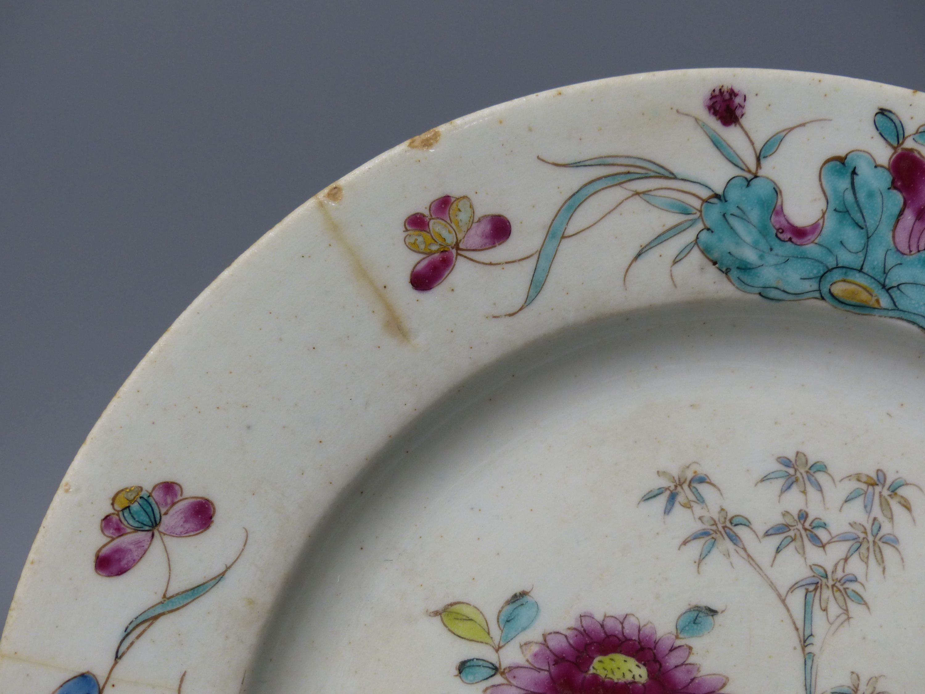 A Bow circular plate painted in famille rose style with chrysanthemums, c.1755, diameter 23cm